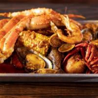 Seafood Combo · Comes with 1 piece of king crab leg, 1 cluster of snow crab leg, 1/2 lb. Of shrimp, 1/2 lb. ...