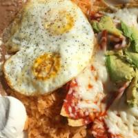 Chilaquiles Con Huevo · Crispy tortilla chips cooked with your choice of green or red sauce topped with melted chees...