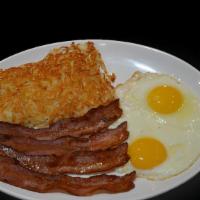 2-Eggs Breakfast · Two eggs, bacon, ham or sausage with toast and hashbrowns.