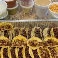 Family Meal Carne Asada · Family meal steak picado with rice, beans, tortilla, chips, and salsa.