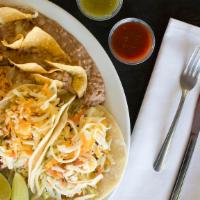 Two Fish Tacos · Fresh cod fish, cabbage, pico de gallo, and tartar sauce.