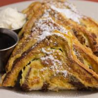 Cinnamon Raisin French Toast · A signature! Egg battered cinnamon raisin bread, whipped butter, maple syrup. White or sourd...