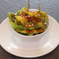 Spicy Edamame · Boiled green soybeans sautéed with olive oil and spicy garlic sauce.