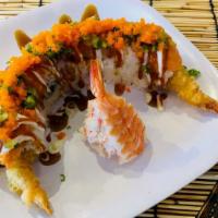 Godzilla Roll · Spicy. Shrimp tempura and spicy tuna inside, topped with variety of fish, masago, green onio...