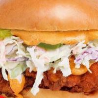 Nashville Hot Fried Chicken Sandwich · Fried chicken breast tossed in Nashville-style spices, house sauce spread, creamy coleslaw, ...