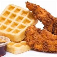 Nashville Hot Fried Chicken & Waffles · Two large fried chicken breast tenders tossed in Nashville-style spices and served with a bu...