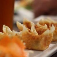 Cheese Wonton · Deep fried cheese with herb wrapped in wonton served with sweet chili sauce.