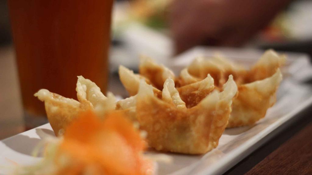 Cheese Wonton · Deep fried cheese with herb wrapped in wonton served with sweet chili sauce.