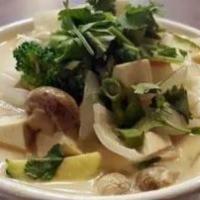 Tom Kha · White mushroom, thai herbs and onion in coconut soup choice of chicken, organic tofu or (shr...