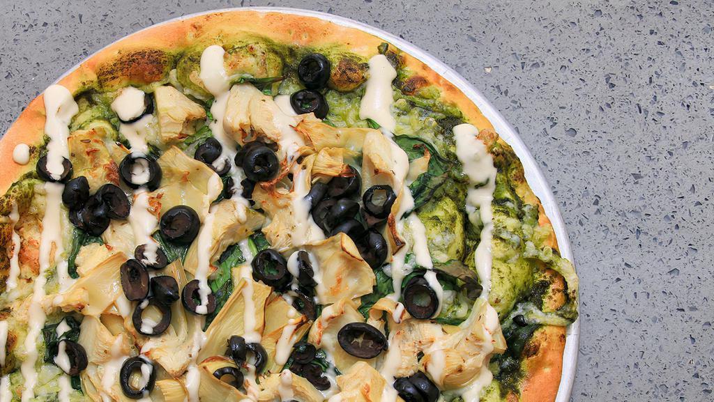 Artichoke Pizza (Plant Based) · Freshly Made crust with House made pesto sauce and  plant based  cheese topped with  artichokes, olives, spinach, and a drizzle of house made garlic aioli sauce.