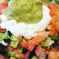 Chili Nachos · Chips, Chili (turkey) Lettuce, Tomato, Salsa (homemade) & Sour Cream... Can Add Steak (Tri-T...