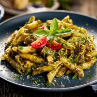 Chicken Penne Pesto · Penne pasta tossed in freshly made pesto and topped with grilled chicken.