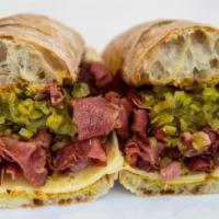 Pastrami Sandwich · Russaks NY pastrami, Swiss, pickle and gulden's mustard.