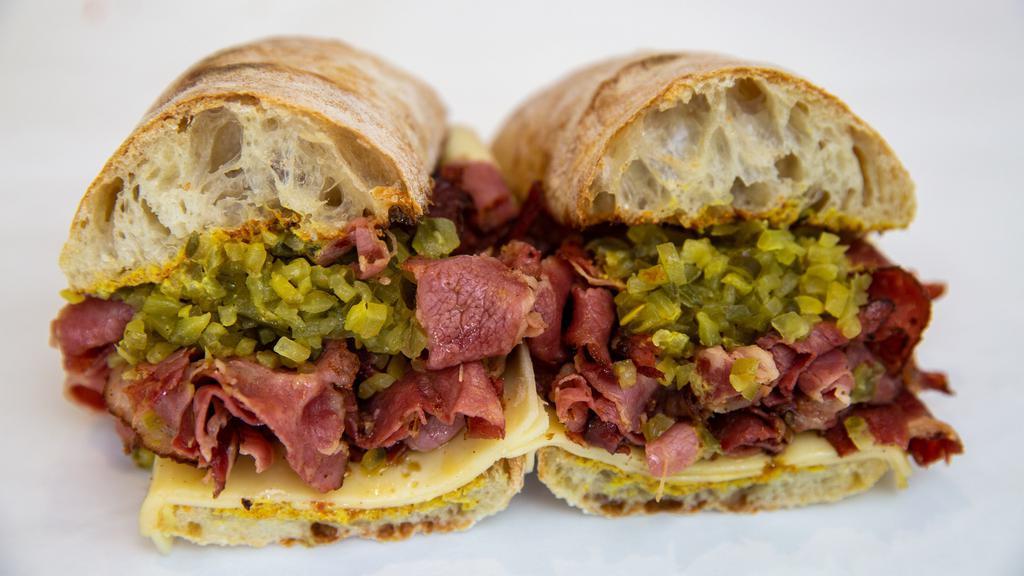 Pastrami Sandwich · Russaks NY pastrami, Swiss, pickle and gulden's mustard.