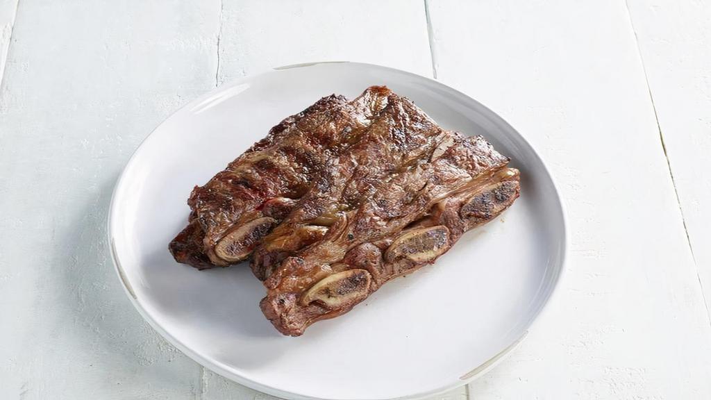 Asado De Tira · Grilled beef short rib.