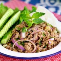 Larb · Most popular. Medium spicy by default. Ground meat mixed with lime, chili, rice powder, mint...
