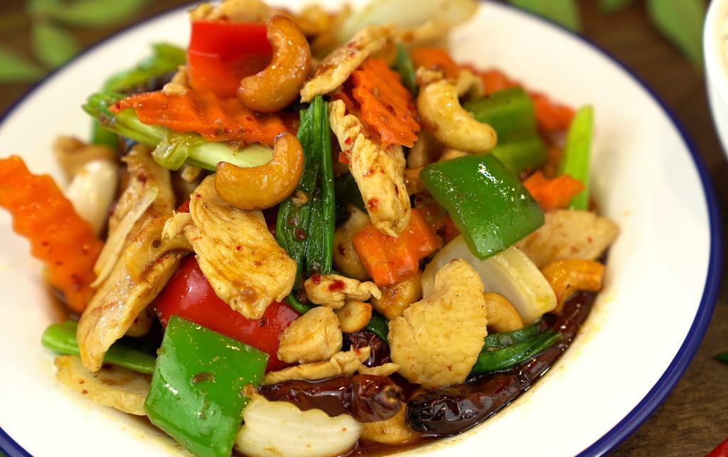 Cashew Nuts · Somewhat spicy. Pineapple, bamboo shoots, carrots, onion, green peppers, mushrooms and cashew nuts.