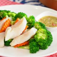 Steamed Fish · Steamed fish fillet, steamed broccoli and carrots served with spicy seafood sauce.