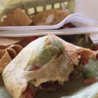 Grande Burrito: · Our original burrito with the addition of rice, beans, sour cream, mild or spicy salsa. & le...