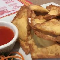 Cream Cheese Wonton · Deep fried cream cheese wonton served with sweet and sour sauce.