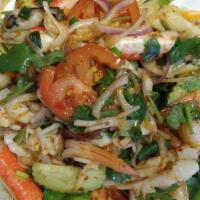 Yum Talay · Shrimp, mussel, and squid seasoned with lemon juice, fish ball, cilantro, imitation crab mea...