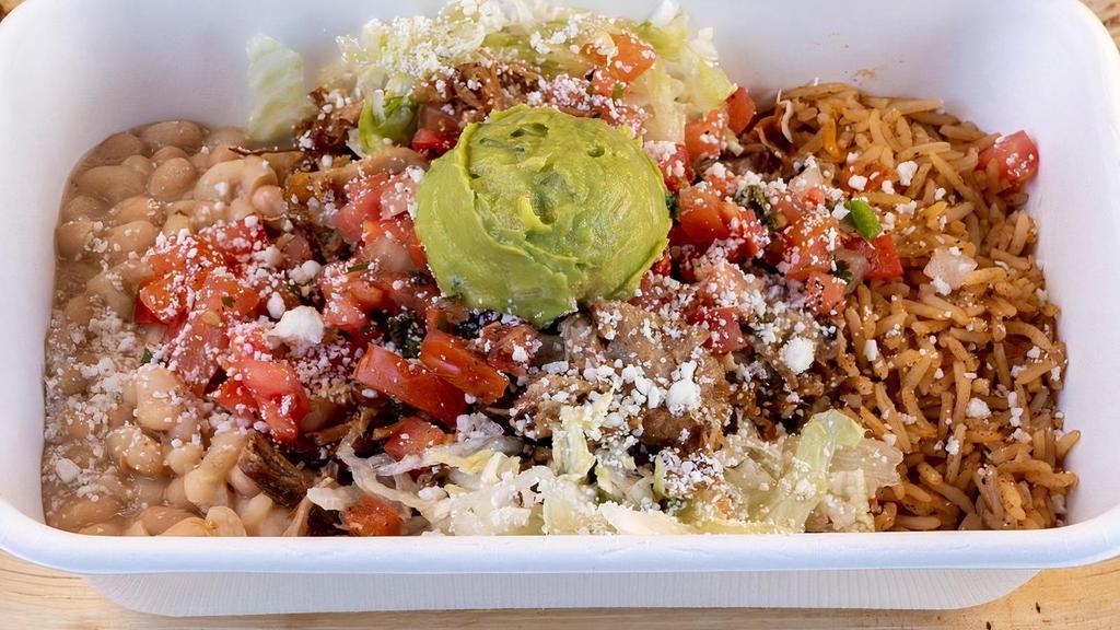 Bowl · Choice of filling, choice of salsa, organic Spanish rice, organic beans, lettuce, onions and cilantro, cotija cheese and guacamole.