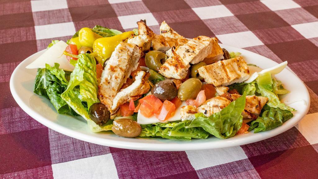 Grilled Chicken Salad · Grilled chicken with provolone cheese, tomatoes, olives, and pepperoncini tossed in our house Italian dressing.