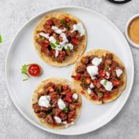 Steak With You (Carne Asada Taco) · Grilled sirloin steak topped with sour cream, salsa, and cilantro. Choice of one or three.