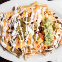 Carne Asada Fries · French fries topped with your choice of nacho cheese or jack cheese, tomatoes, jalapeños, so...