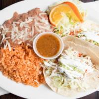 Super Taco · A corn tortilla topped with your choice of meat, lettuce, tomato, onion, cheese, guacamole, ...