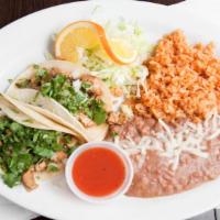 Two Tacos Plate · Two soft corn tortilla tacos topped with choice of meat, onion, cilantro, and served with ri...
