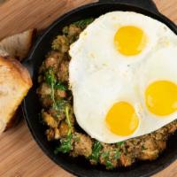 Meatloaf Hash · Eggs any style, spinach, house-made meatloaf, pesto, house potatoes and choice of bread.