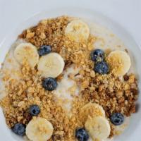 Yogurt & Granola · banana infused whipped yogurt, house granola, fresh bananas, blueberries and peanut brittle