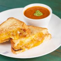 Grilled Cheese & Tomato Soup · brioche bread, mozzarella and cheddar cheese. served with a cup of tomato bisque plus your c...