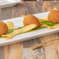 Papa Rellena · Mashed potato balls (3) filled with beef picadillo.