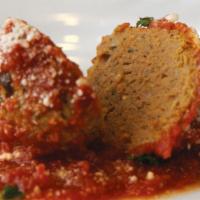 Meatballs (2) · 100 % all beef in tangy tomato sauce.