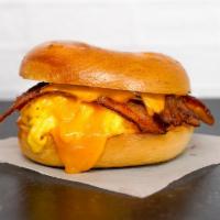 Bagel, Bacon, Egg, & Cheddar Sandwich · 2 scrambled eggs, melted Cheddar cheese, smoked bacon, and Sriracha aioli on a toasted bagel.