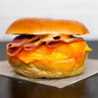 Bagel, Ham, Egg, & Cheddar Sandwich · 2 scrambled eggs, melted Cheddar cheese, sliced ham, and Sriracha aioli on a toasted bagel.