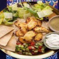 Chicken Shawarma Hummus Platter · Chicken shawarma served over hummus with salad, grilled tomatoes, pita, and your choice of s...