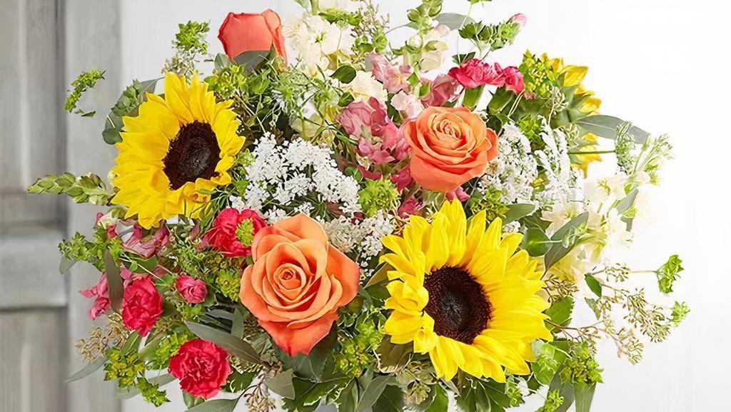 Sunshine Splendor™ Bouquet By Southern Living · All-around arrangement with orange roses, sunflowers, pink snapdragons, hot pink mini carnations, cream stock and Queen Anne’s Lace; accented with assorted greenery. Gift this to anyone to brighten up their day!