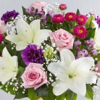 Glorious Jewel™ Bouquet · Have a special occasion?  A delicate pink vase filled with pink roses, purple carnations, wh...