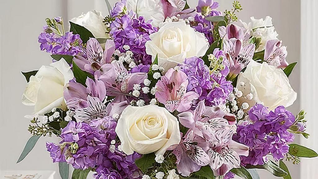 Lovely Lavender Medley™ · You can't go wrong with this purple bouquet. Our charming lavender flower bouquet is loosely gathered with a medley of lavender & white blooms. Hand-designed inside a clear cylinder vase