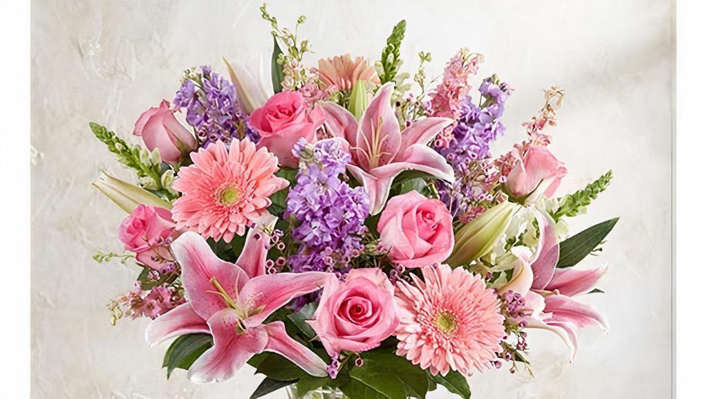 Always On My Mind · Wanna show appreciation to your significant other? This arrangement of pink and purple flowers are sure to make one feel loved. This bouquet includes pink roses, Gerbera daisies, Oriental lilies, and larkspur, white snapdragons, and lavender stock.