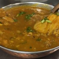 Chicken Curry · Non-vegetarian. Chicken cooked with fresh tomatoes, fresh garlic, fresh ginger and Indian sp...