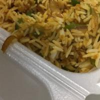Lamb Biryani · Saffron flavored lamb and basmati rice cooked with golden fried onions.