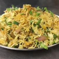 Goat Biryani · Saffron flavored goat meat and basmati rice cooked with golden fried onions.