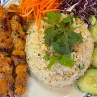 Thai Bbq Chicken & Fried Rice · (4) Skewers Chicken BBQ with Thai Herb Sauce and Thai Fried Rice with egg, peas, carrot, yel...