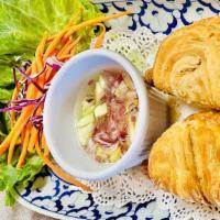 Curry Puffs · 2 pieces. Stuffed with potato, onions and curry powder.