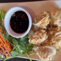 Thai Dumpling · 5 pieces. Stuffed with ground pork and shrimp, steamed and served with black sweet sauce.