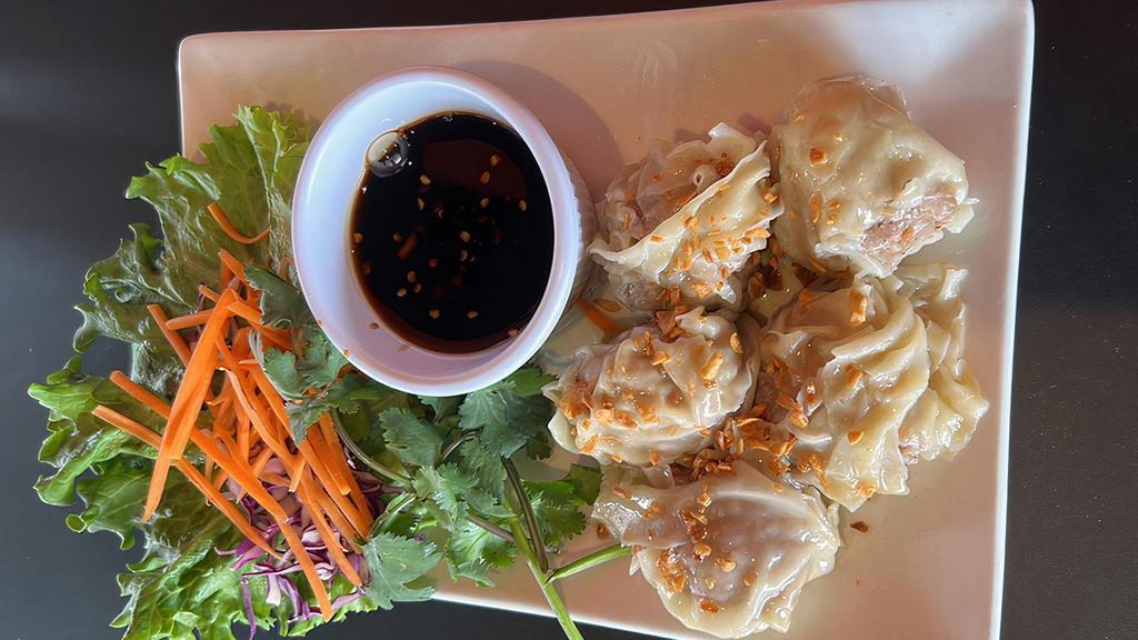 Thai Dumpling · 5 pieces. Stuffed with ground pork and shrimp, steamed and served with black sweet sauce.
